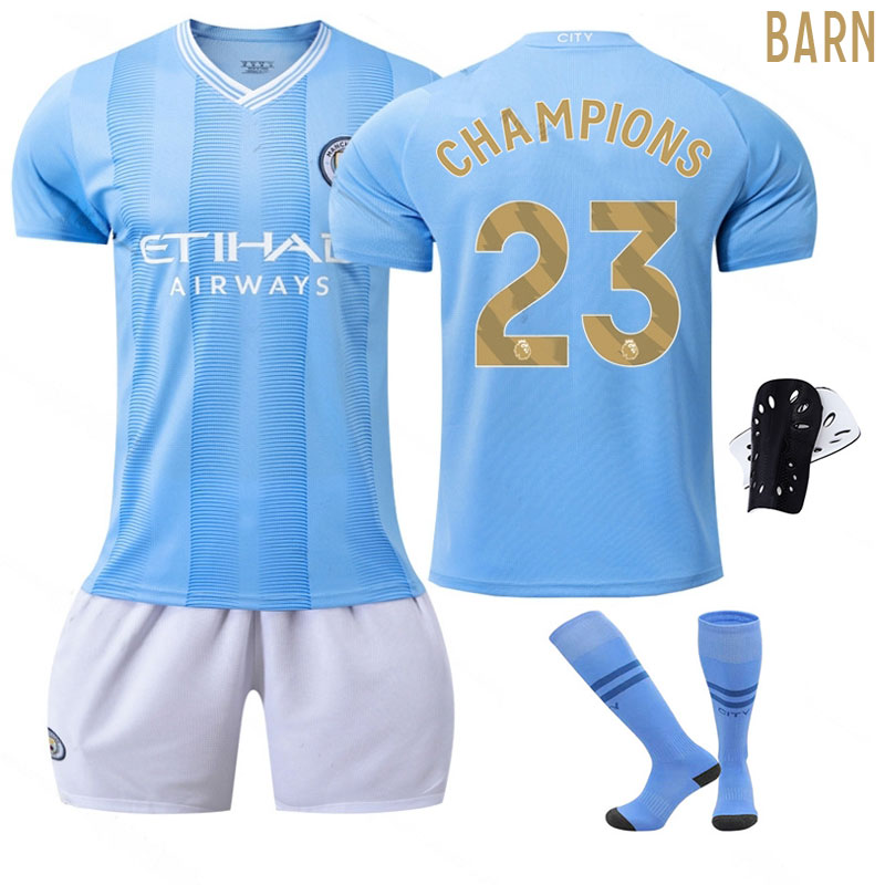 Barn Fotballdrakter Manchester City 2023/24 Hjemmedrakt Med originalt CHAMPIONS 23 trykk